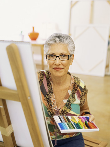 Portrait of a senior woman drawing